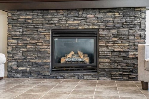 495 Cranford Drive Se, Calgary, AB - Indoor Photo Showing Other Room With Fireplace
