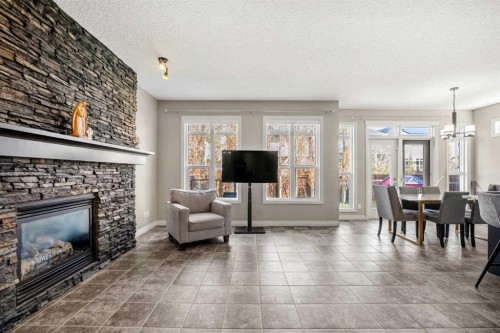 495 Cranford Drive Se, Calgary, AB - Indoor Photo Showing Living Room With Fireplace