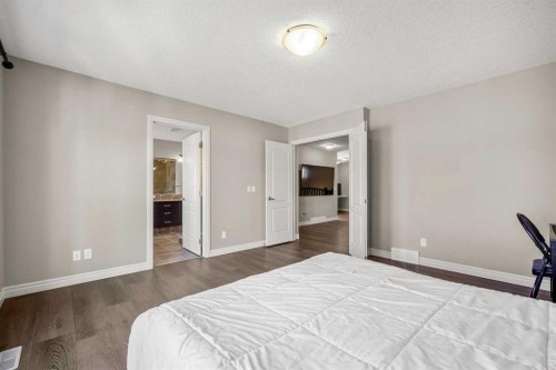 495 Cranford Drive Se, Calgary, AB - Indoor Photo Showing Bedroom