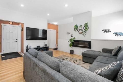 153 Savanna Walk Ne, Calgary, AB - Indoor Photo Showing Living Room With Fireplace
