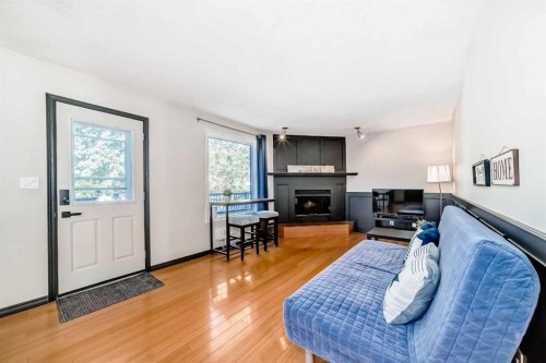 6907 6 Street Sw, Calgary, AB - Indoor Photo Showing Living Room With Fireplace