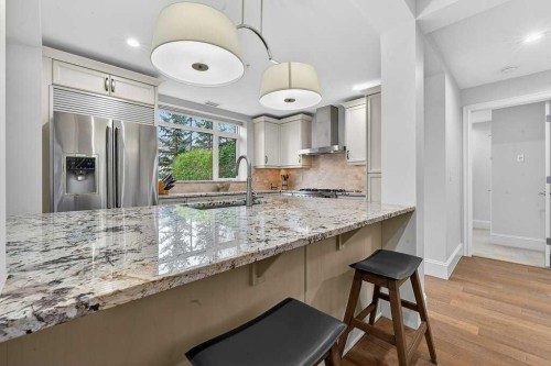 107-121 Quarry Way Se, Calgary, AB - Indoor Photo Showing Kitchen With Upgraded Kitchen