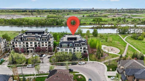 107-121 Quarry Way Se, Calgary, AB - Outdoor With Body Of Water With View
