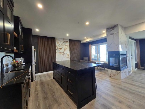 71 Muirfield Close, Lyalta, AB - Indoor Photo Showing Kitchen With Fireplace
