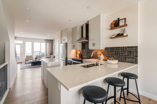 708 Sovereign Common Sw, Calgary, AB - Indoor Photo Showing Kitchen With Double Sink With Upgraded Kitchen