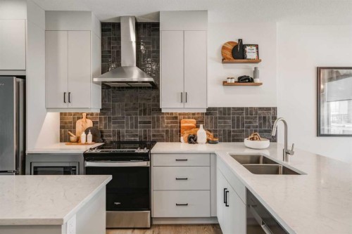 708 Sovereign Common Sw, Calgary, AB - Indoor Photo Showing Kitchen With Double Sink With Upgraded Kitchen