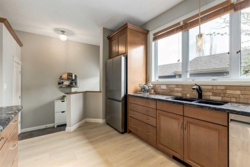 3117 Don Ethell Boulevard Sw, Calgary, AB - Indoor Photo Showing Kitchen With Double Sink