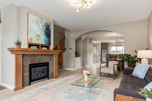 3117 Don Ethell Boulevard Sw, Calgary, AB - Indoor Photo Showing Living Room With Fireplace