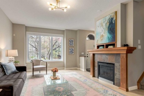 3117 Don Ethell Boulevard Sw, Calgary, AB - Indoor Photo Showing Living Room With Fireplace