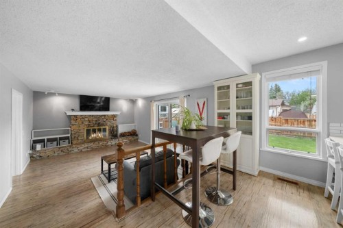 38 Suntree Lane, Okotoks, AB - Indoor With Fireplace