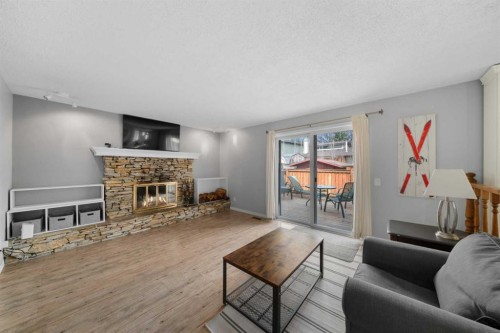 38 Suntree Lane, Okotoks, AB - Indoor Photo Showing Living Room With Fireplace