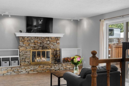38 Suntree Lane, Okotoks, AB - Indoor Photo Showing Living Room With Fireplace
