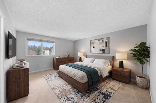 38 Suntree Lane, Okotoks, AB - Indoor Photo Showing Bedroom