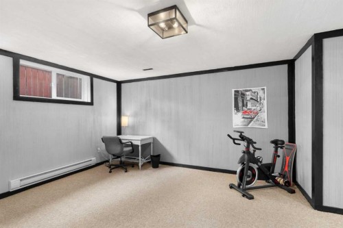 38 Suntree Lane, Okotoks, AB - Indoor Photo Showing Gym Room