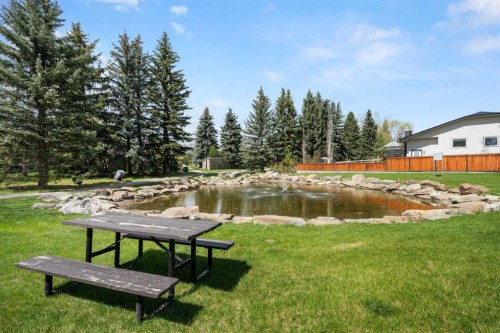 38 Suntree Lane, Okotoks, AB - Outdoor With Body Of Water