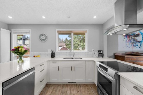 38 Suntree Lane, Okotoks, AB - Indoor Photo Showing Kitchen With Double Sink With Upgraded Kitchen