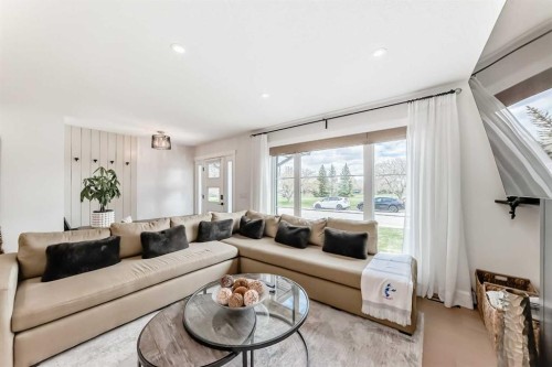 19 Mackay Drive Sw, Calgary, AB - Indoor Photo Showing Living Room
