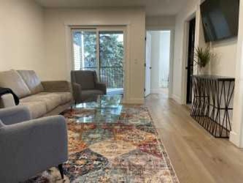 19 Mackay Drive Sw, Calgary, AB - Indoor Photo Showing Living Room