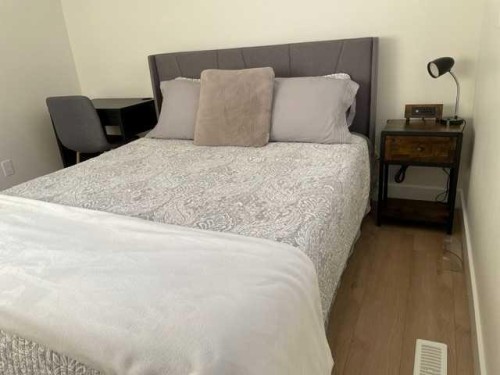19 Mackay Drive Sw, Calgary, AB - Indoor Photo Showing Bedroom