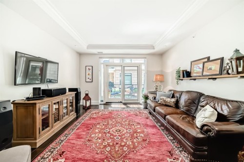 105-121 Quarry Way Se, Calgary, AB - Indoor Photo Showing Living Room
