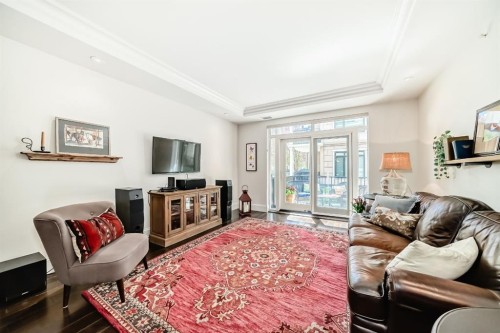 105-121 Quarry Way Se, Calgary, AB - Indoor Photo Showing Living Room
