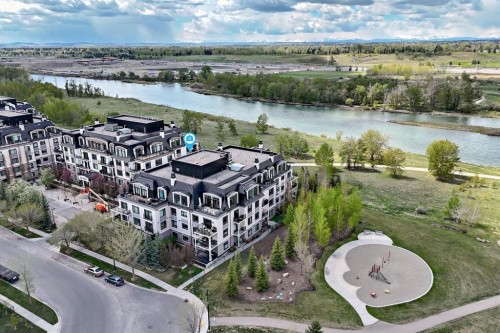 105-121 Quarry Way Se, Calgary, AB - Outdoor With Body Of Water With View