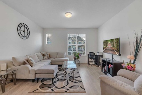 554 Copperstone Manor Se, Calgary, AB - Indoor Photo Showing Living Room