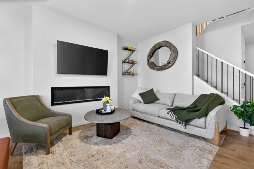 36 Royston Rise Nw, Calgary, AB - Indoor Photo Showing Living Room With Fireplace