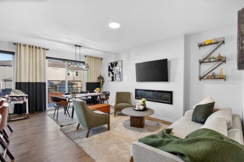36 Royston Rise Nw, Calgary, AB - Indoor Photo Showing Living Room With Fireplace