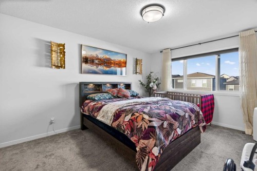 36 Royston Rise Nw, Calgary, AB - Indoor Photo Showing Bedroom