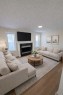 107 Harvest Oak Crescent Ne, Calgary, AB  - Indoor Photo Showing Living Room With Fireplace 