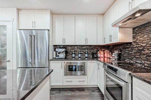 144 Copperpond Parade Se, Calgary, AB - Indoor Photo Showing Kitchen With Stainless Steel Kitchen With Upgraded Kitchen