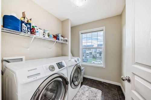 144 Copperpond Parade Se, Calgary, AB - Indoor Photo Showing Laundry Room