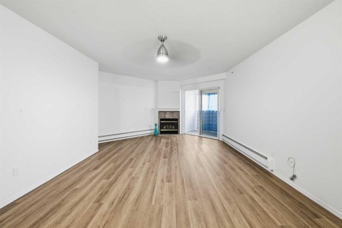 439-165 Manora Place Ne, Calgary, AB - Indoor With Fireplace