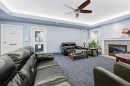 439-165 Manora Place Ne, Calgary, AB  - Indoor Photo Showing Living Room With Fireplace 