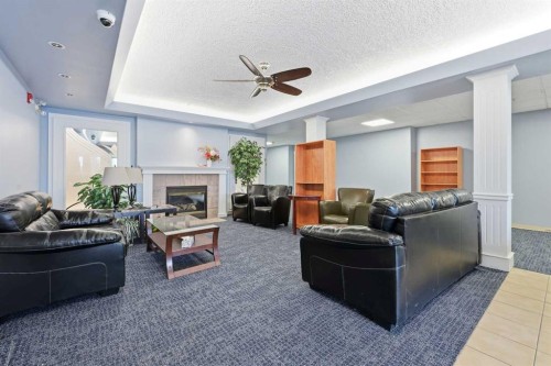 439-165 Manora Place Ne, Calgary, AB - Indoor With Fireplace