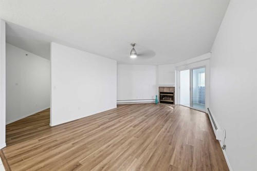 439-165 Manora Place Ne, Calgary, AB - Indoor With Fireplace