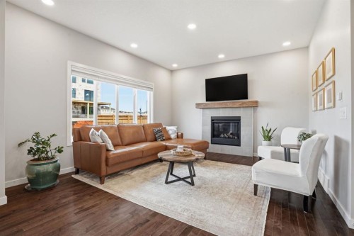 81 Mount Rae Heights, Okotoks, AB - Indoor Photo Showing Living Room With Fireplace
