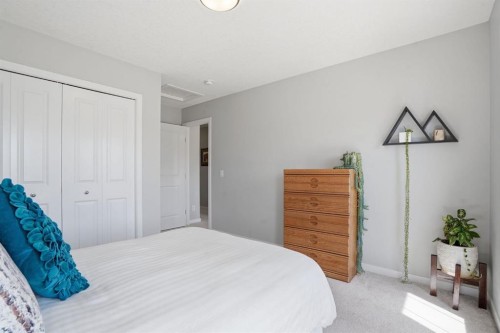 81 Mount Rae Heights, Okotoks, AB - Indoor Photo Showing Bedroom