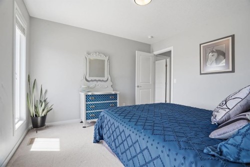 81 Mount Rae Heights, Okotoks, AB - Indoor Photo Showing Bedroom