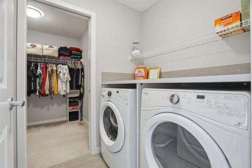 81 Mount Rae Heights, Okotoks, AB - Indoor Photo Showing Laundry Room