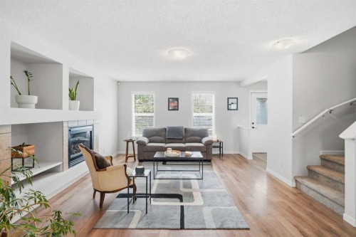29 Copperfield Heath Se, Calgary, AB - Indoor Photo Showing Living Room With Fireplace