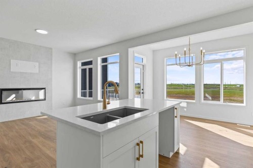 131 Corner Glen Grove Ne, Calgary, AB - Indoor Photo Showing Kitchen With Fireplace With Double Sink