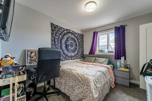 110 Hillcrest Close Sw, Airdrie, AB - Indoor Photo Showing Bedroom