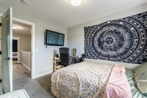 110 Hillcrest Close Sw, Airdrie, AB - Indoor Photo Showing Bedroom