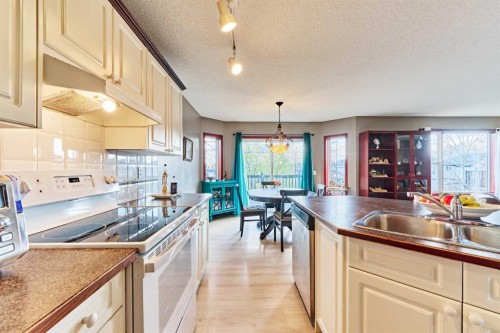 132 Somercrest Close Sw, Calgary, AB - Indoor Photo Showing Kitchen With Double Sink