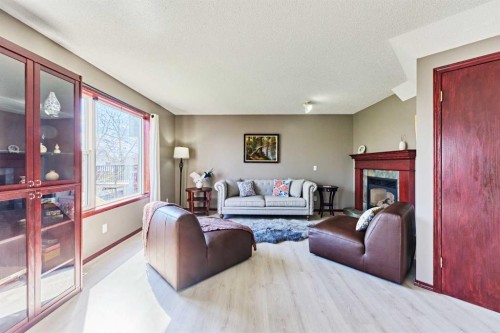 132 Somercrest Close Sw, Calgary, AB - Indoor Photo Showing Living Room With Fireplace