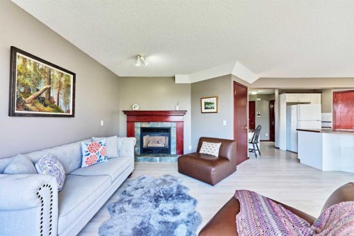 132 Somercrest Close Sw, Calgary, AB - Indoor Photo Showing Living Room With Fireplace