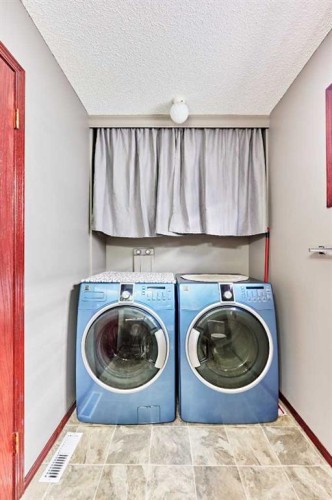 132 Somercrest Close Sw, Calgary, AB - Indoor Photo Showing Laundry Room