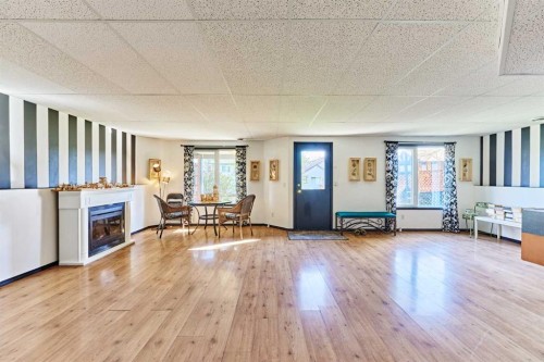 132 Somercrest Close Sw, Calgary, AB - Indoor Photo Showing Living Room With Fireplace